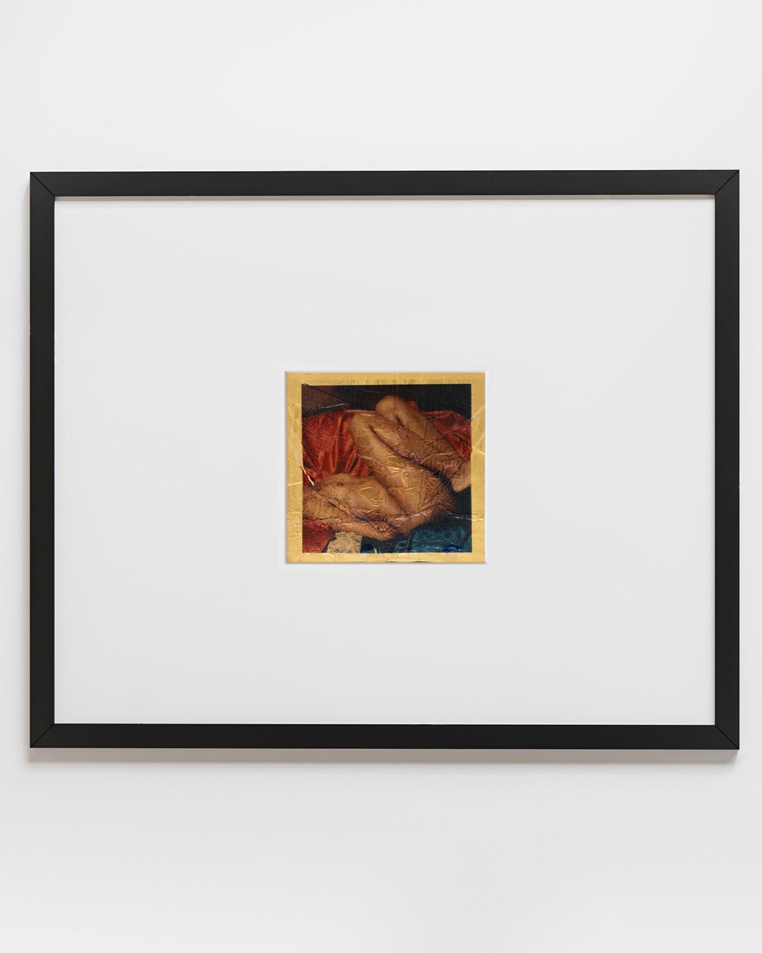 Gold displayed horizontally in its black frame